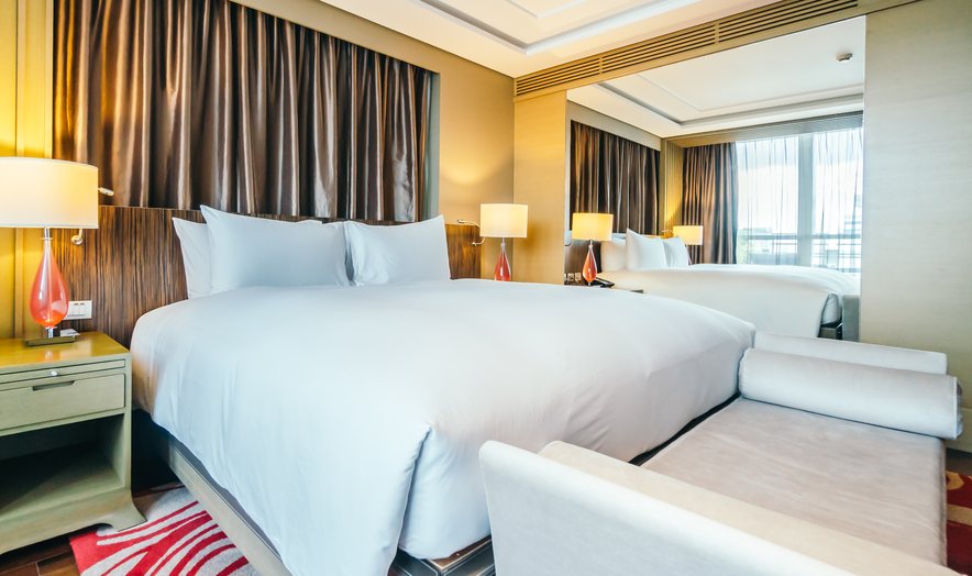 Boutique hotel room with a made bed