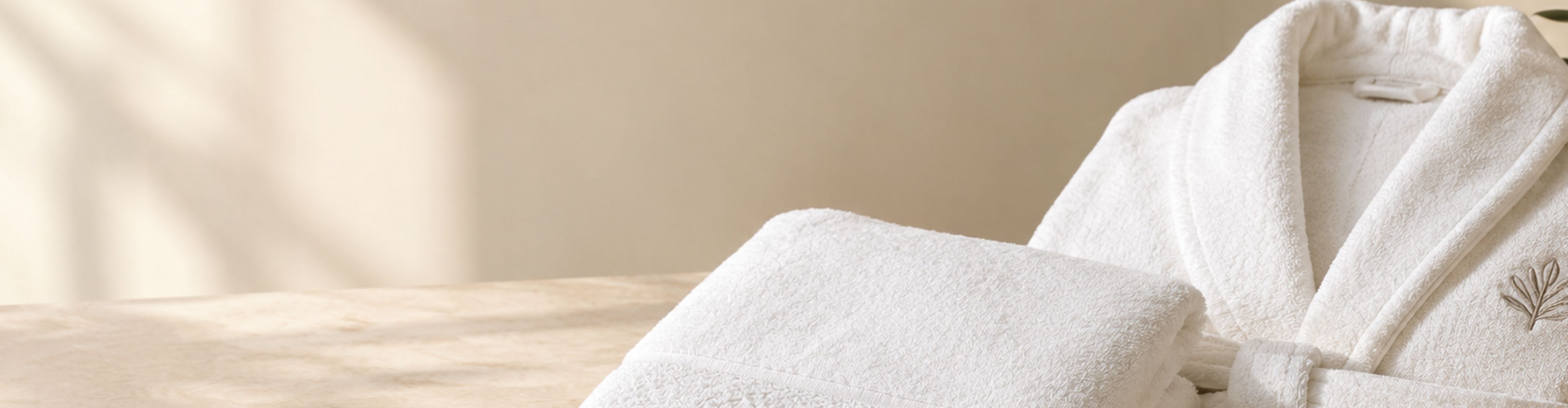Embroidered robe and towel on a table