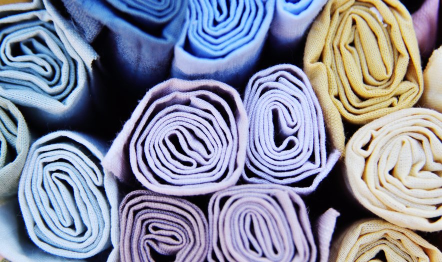 Rolled towels in a range of colours