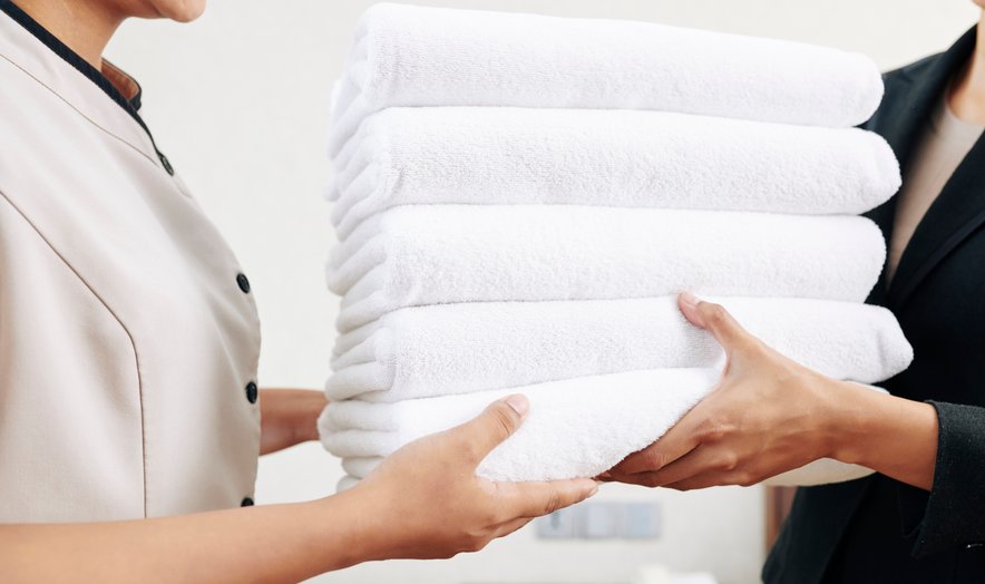 White towels being handed over