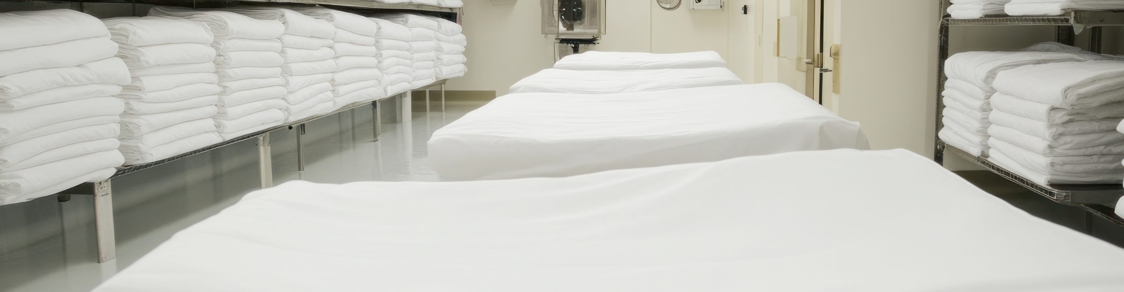 Neatly stacked white linens