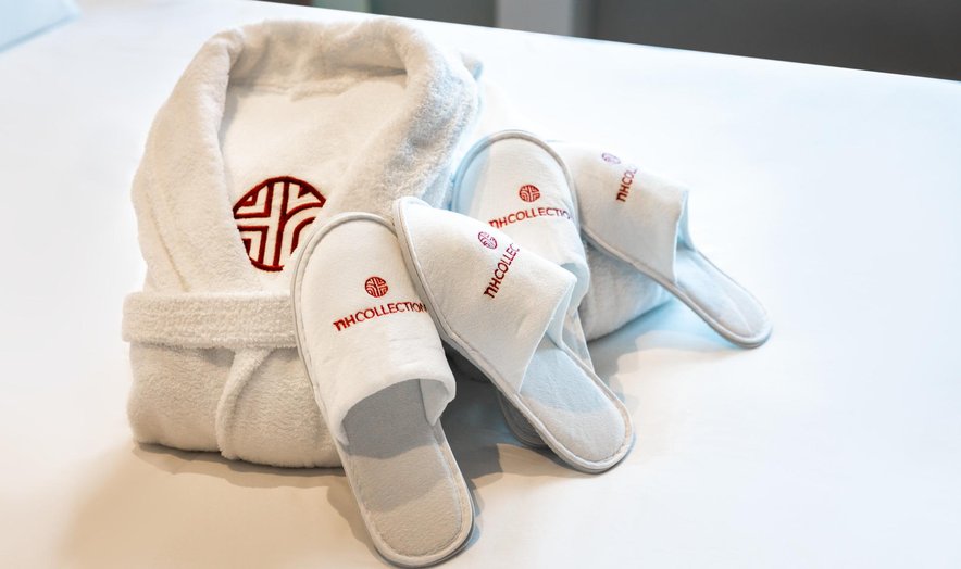 Robe and slippers embroidered with a hotel logo